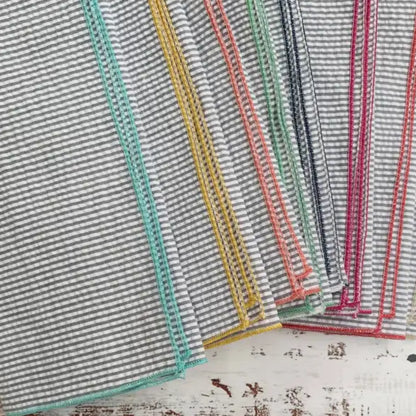 Handcrafted grey seersucker cloth napkins with colorful edges, set of 8