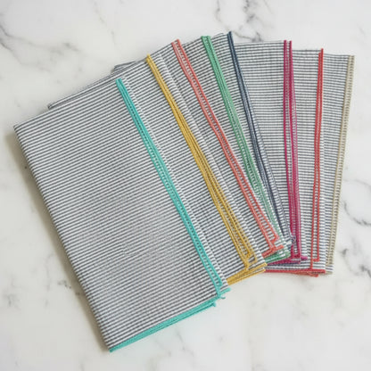 Handcrafted grey seersucker napkins set with colorful edges