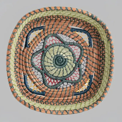 Intricately woven basket of native wild grass, and pine needles with colorful raffia accents.