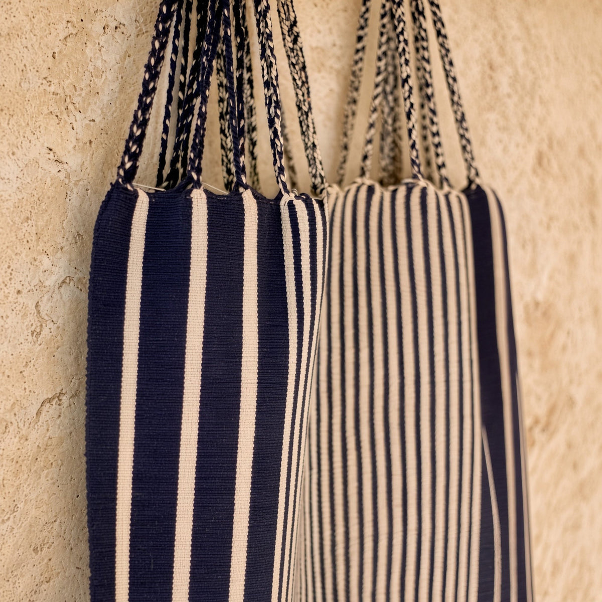 Navy and cream striped hammock tote bag handwoven in mexico by indigenous mayan artisans with braided handles