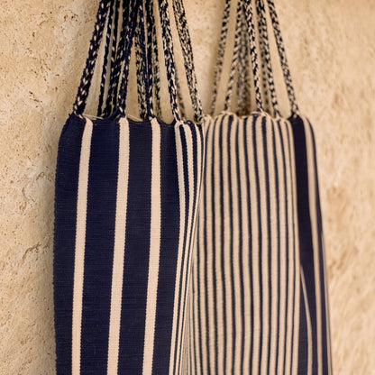 Navy and cream striped hammock tote bag handwoven in mexico by indigenous mayan artisans with braided handles
