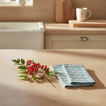 Hand block printed fair trade Mehera Shaw green leaf and berry organic cotton fabric with napkins