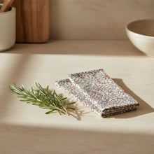 Two folded hand block printed fair trade organic cotton cloths with geometric pattern