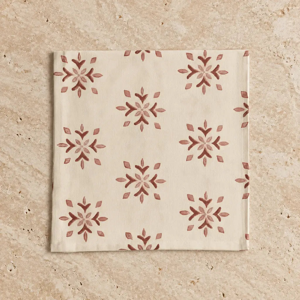Cream-colored hand block printed organic cotton fabric napkin with rust-red amber mosaic design floral motifs set of 4