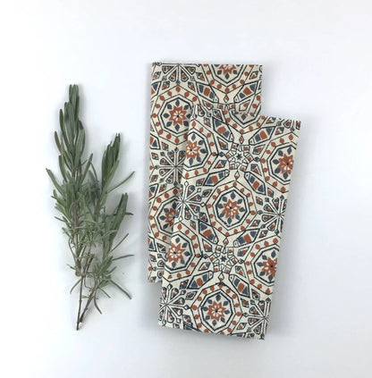 Two folded hand block printed fair trade organic cotton cloths with geometric pattern