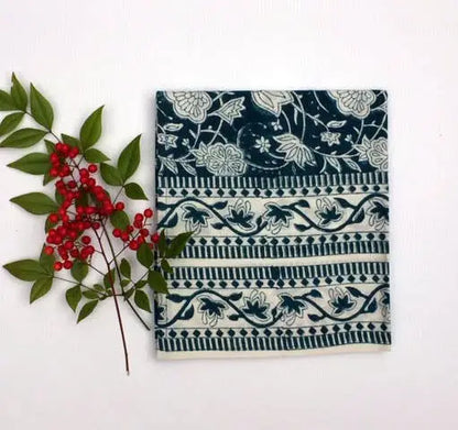 Hand block printed fair trade cloth napkin with dark teal and cream floral pattern