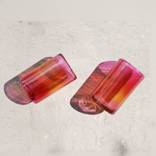 Hand blown glass tumbler in vibrant gradient colors, 