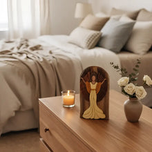 Hand-carved wooden joyful angel wall art with flowing yellow gown and secret compartment for gift cards in arched frame