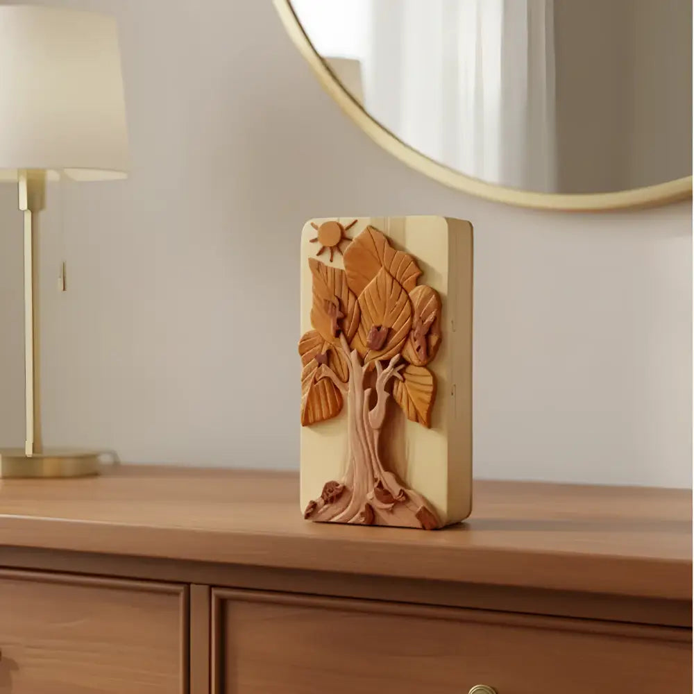Hand carved wooden tree box with layered leaves sun motif natural wood tones and hidden compartment design
