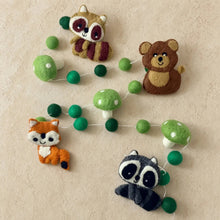 Hand-felted wool forest animal garland with whimsical forest friends raccoons bears foxes and green pom-pom mushrooms