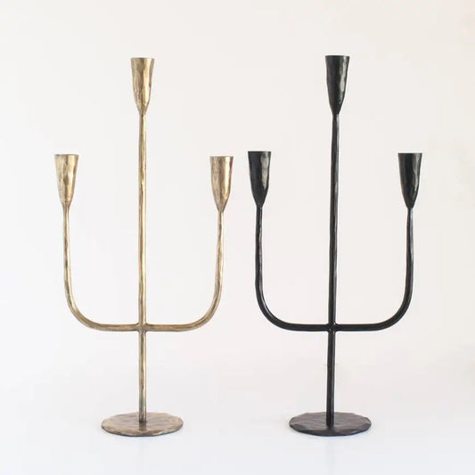Hand Forged Iron Candelabra in brass and black on light background