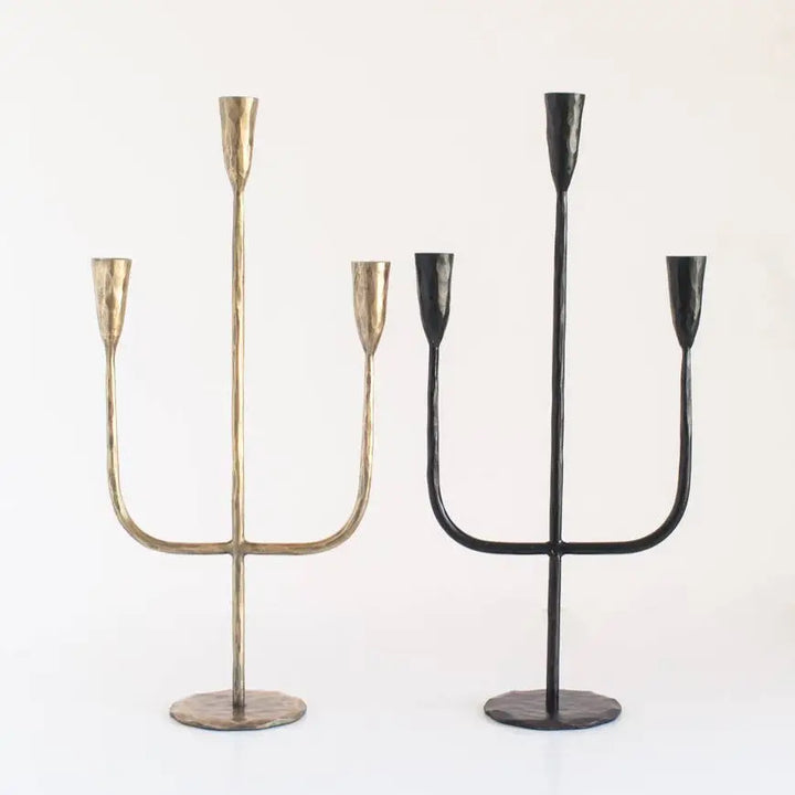 Hand Forged Iron Candelabra in brass and black on light background