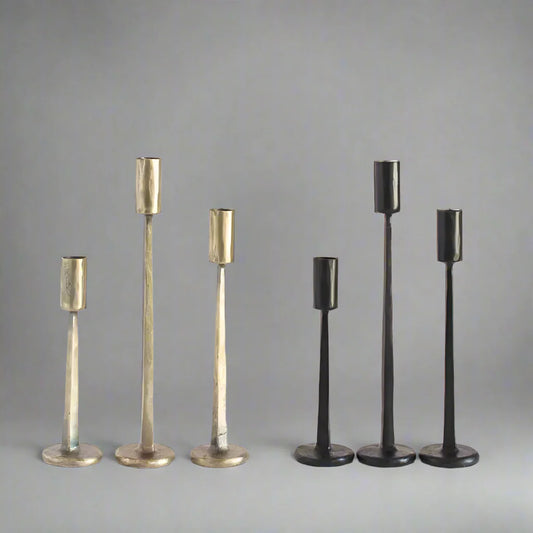 Hand forged iron candle stands in gold and black finishes, perfect for stylish decor
