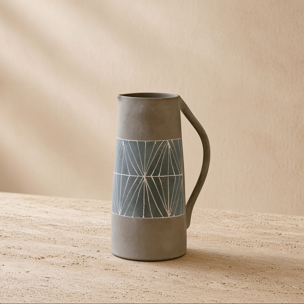 Matte gray hand-painted terracotta table pitcher with geometric white line pattern and curved handle for table vase sets