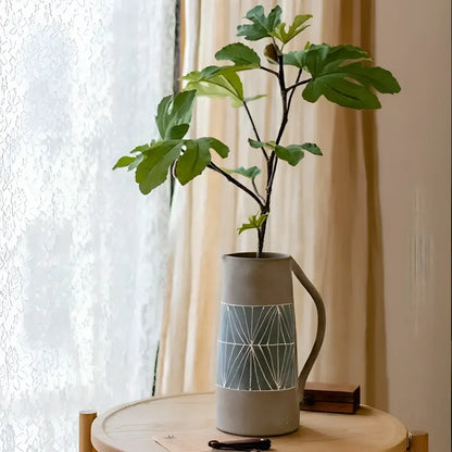 Tall gray hand-painted terracotta table pitcher vase with geometric pattern and leafy plant
