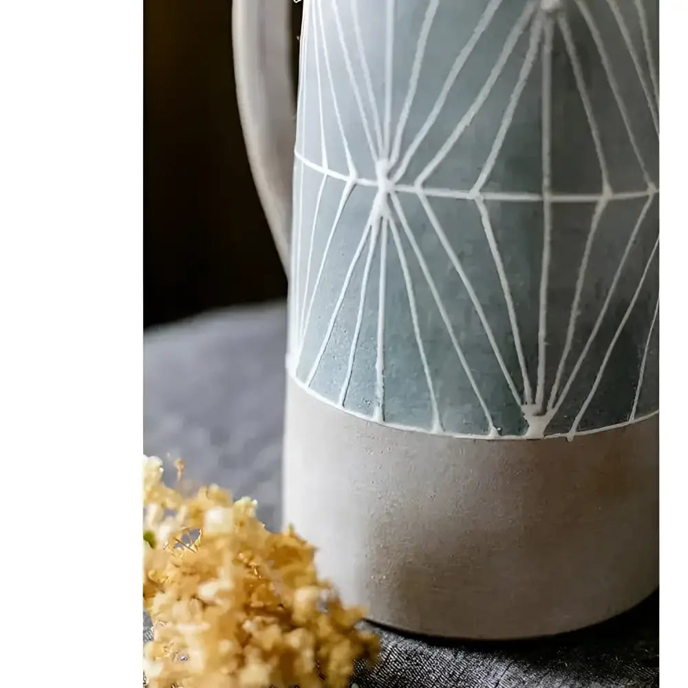 Hand-painted terracotta two-toned ceramic table pitcher with geometric pattern