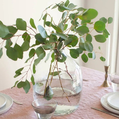 Handblown hammered glass vase with eucalyptus branches made from recycled glass