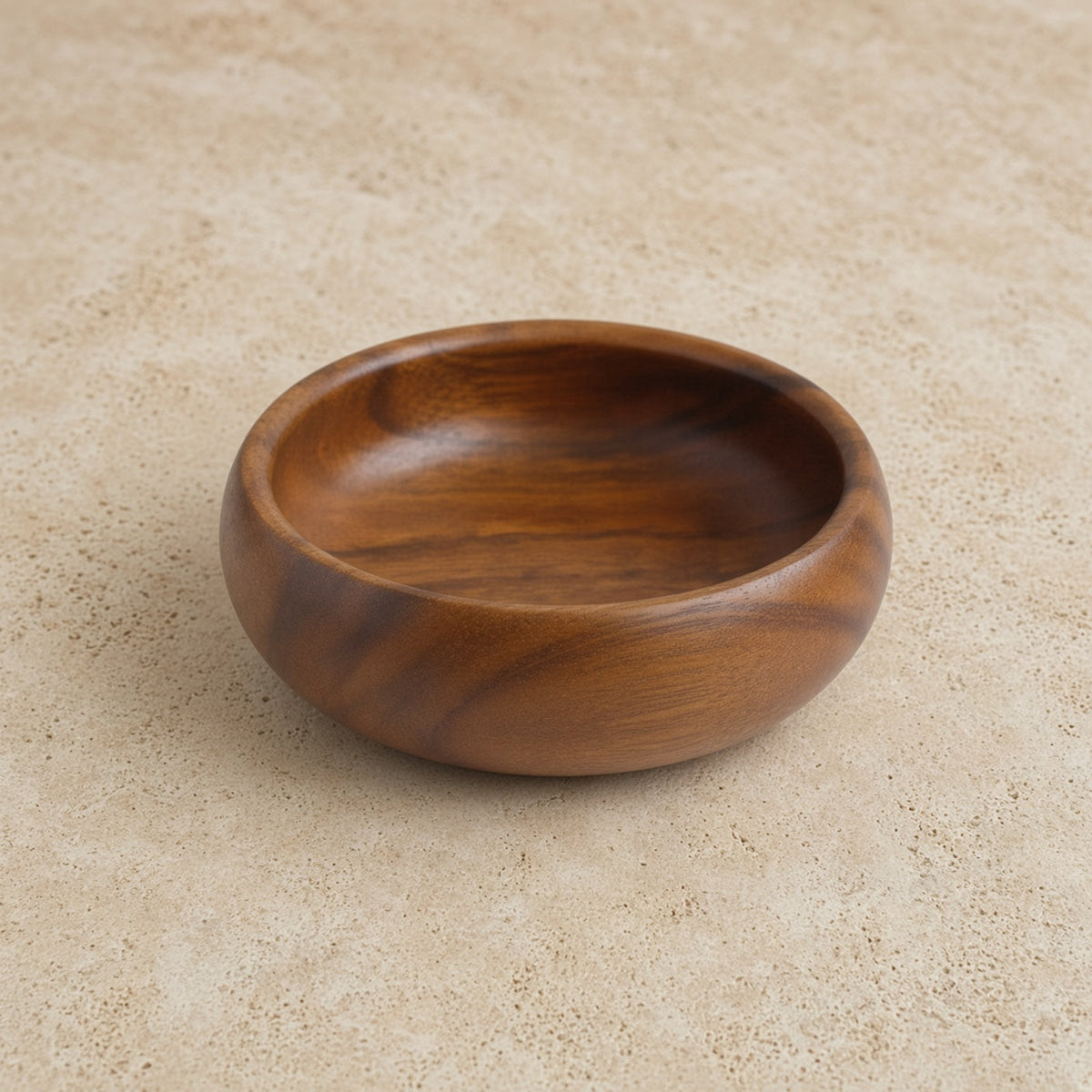 Handcrafted acacia wood round salad bowl with a smooth rich brown finish and visible natural wood grain