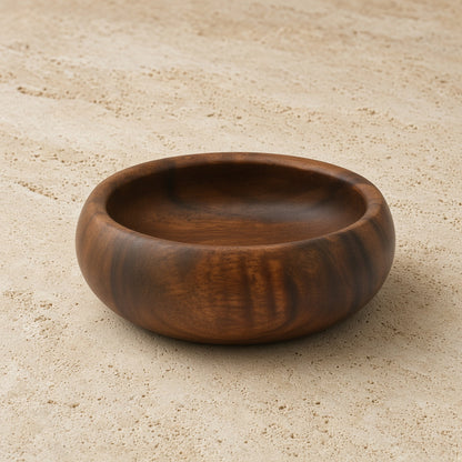 Handcrafted acacia wood round salad bowl with a smooth rich brown finish and natural wood grain pattern