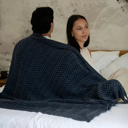 Handcrafted blue herringbone knit shawl with textured chevron weave