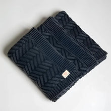 Handcrafted dark blue cable knit shawl with herringbone chevron pattern