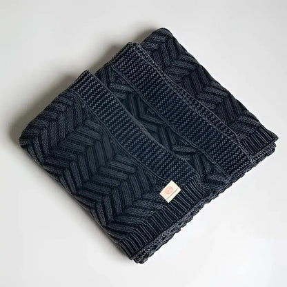 Handcrafted dark blue cable knit shawl with herringbone chevron pattern