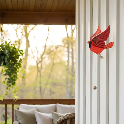 Handcrafted cardinal mobile in vibrant red metal with black markings and detailed wings for playful flutter and perfectly balanced display