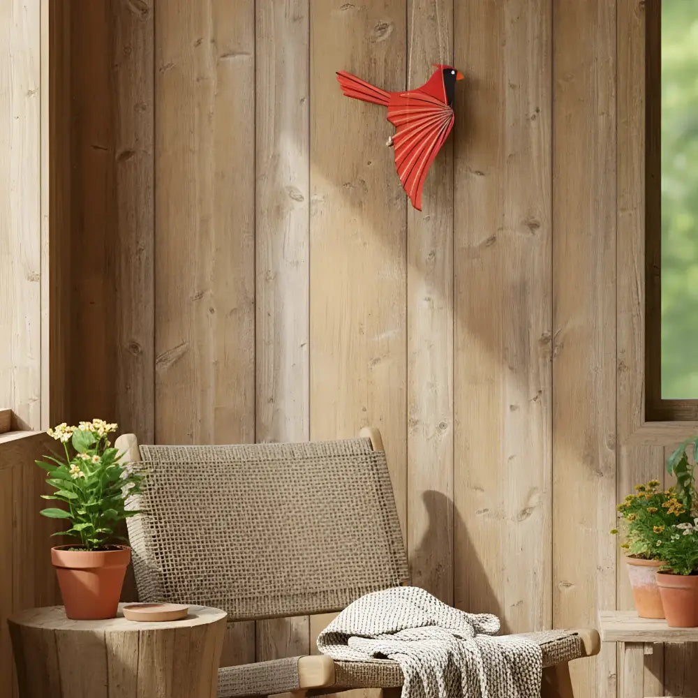 Handcrafted cardinal flying bird mobile featuring a vibrant red wooden cardinal mobile with a playful flutter design
