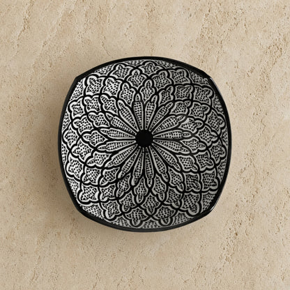Black and white handcrafted ceramic bowl with intricate floral pattern from safi morocco inspired by rugged atlantic designs