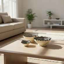 Set of three handcrafted ceramic bowls from Safi Morocco with black patterns on rugged Atlantic coast