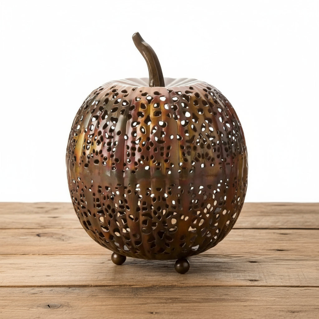 Handmade eco-friendly metal pumpkin lantern with intricate cut-out design in brown and gold tones