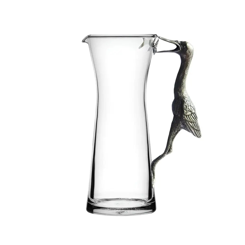 Handcrafted glass pitcher with pewter crane handle for elegant, eco-friendly beverage serving