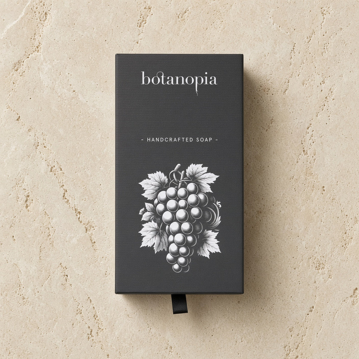 Botanopia handcrafted grape soap in a sleek black box with white grapevine olive oil design handcrafted grape soap