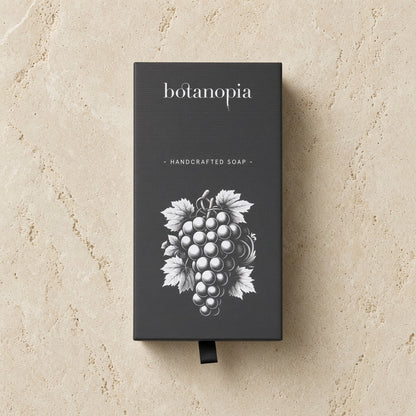 Botanopia handcrafted grape soap in a sleek black box with white grapevine olive oil design handcrafted grape soap