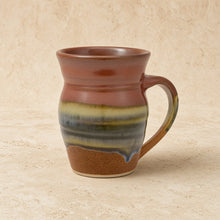 Handcrafted pottery mug aztec sunrise with rustic brown green blue glaze stripes and sunrise vibes drip design