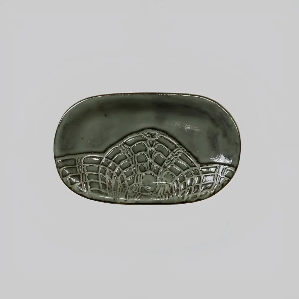 Handcrafted stoneware dish with lace pattern in matte gray glaze