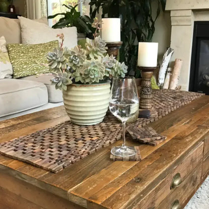 Potted succulent plant with pale green rosettes on a handcrafted Rosewood Table Runner