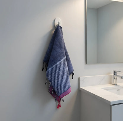 A handloomed turkish cotton bath towel in navy blue and pink stripes with fringed edges by skilled artisans indigo tribeca