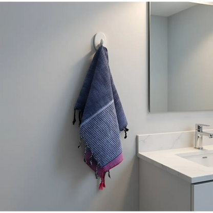 A handloomed turkish cotton bath towel in navy blue and pink stripes with fringed edges by skilled artisans indigo tribeca