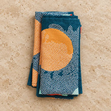 Handmade blue european linen dinner napkins set of 4 with teal and orange patterns and white dot accents