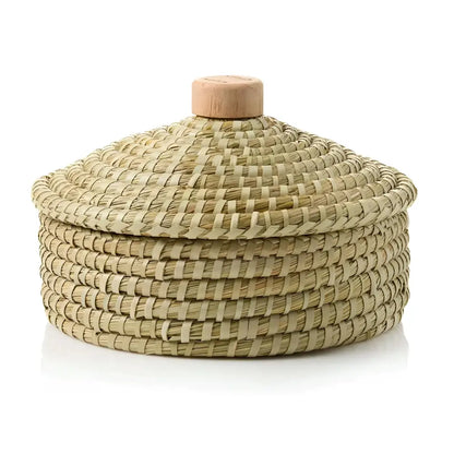 Handmade bread basket with warming stone and lid in natural woven straw with wooden handle