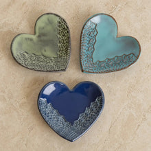 Three handmade ceramic heart trinket dishes in green gray teal blue and deep navy with lace edge patterns
