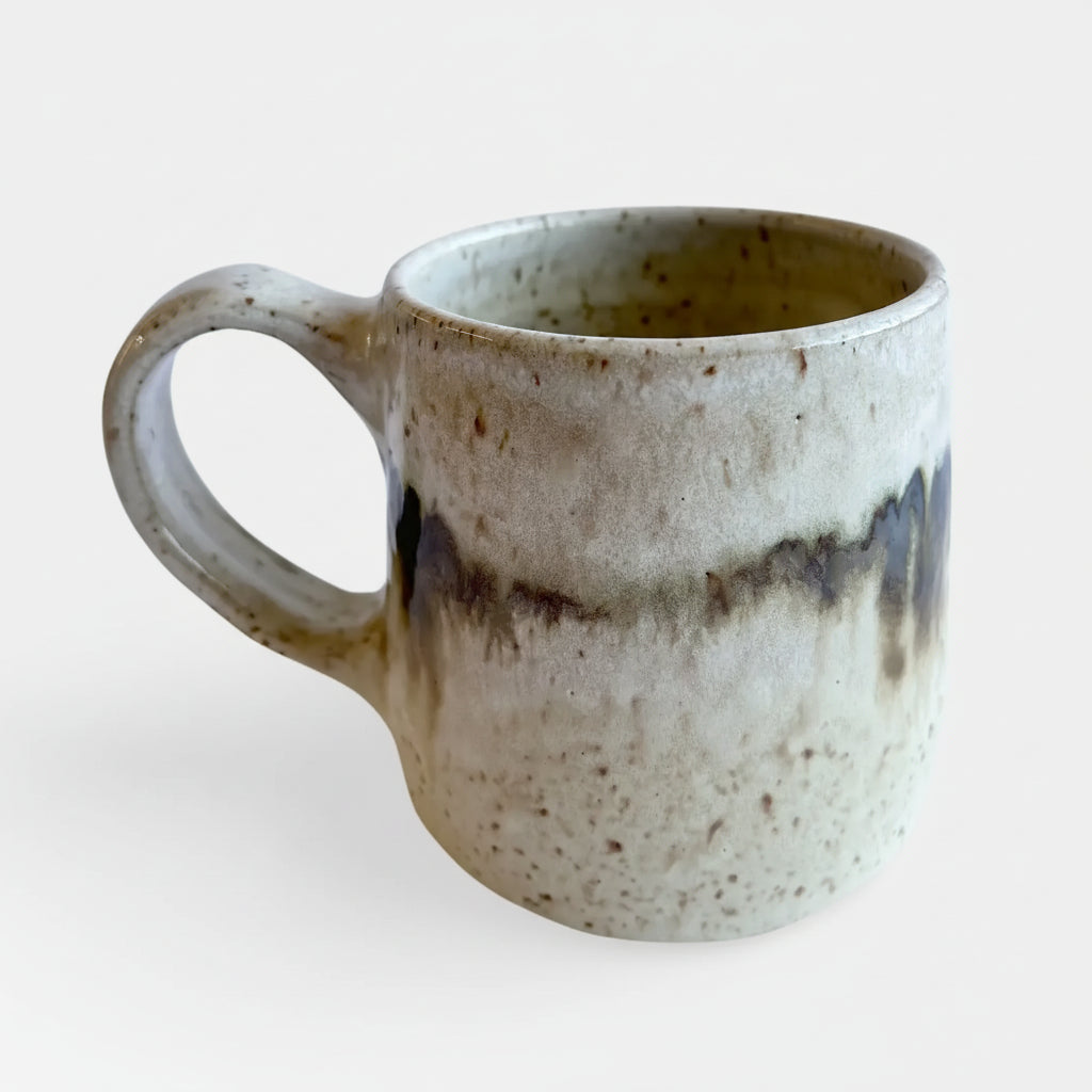 Handmade ceramic mug with unique glaze combo and earthy drip pattern from Borealis Collection