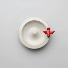 Handmade ceramic ring dish with perched red bird airplane hook