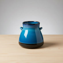 Handmade ceramic vase with blue and white gradient and black handles from Bat Trang