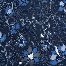 Blue floral paisley tie on handmade cotton tablecloth with indigo background