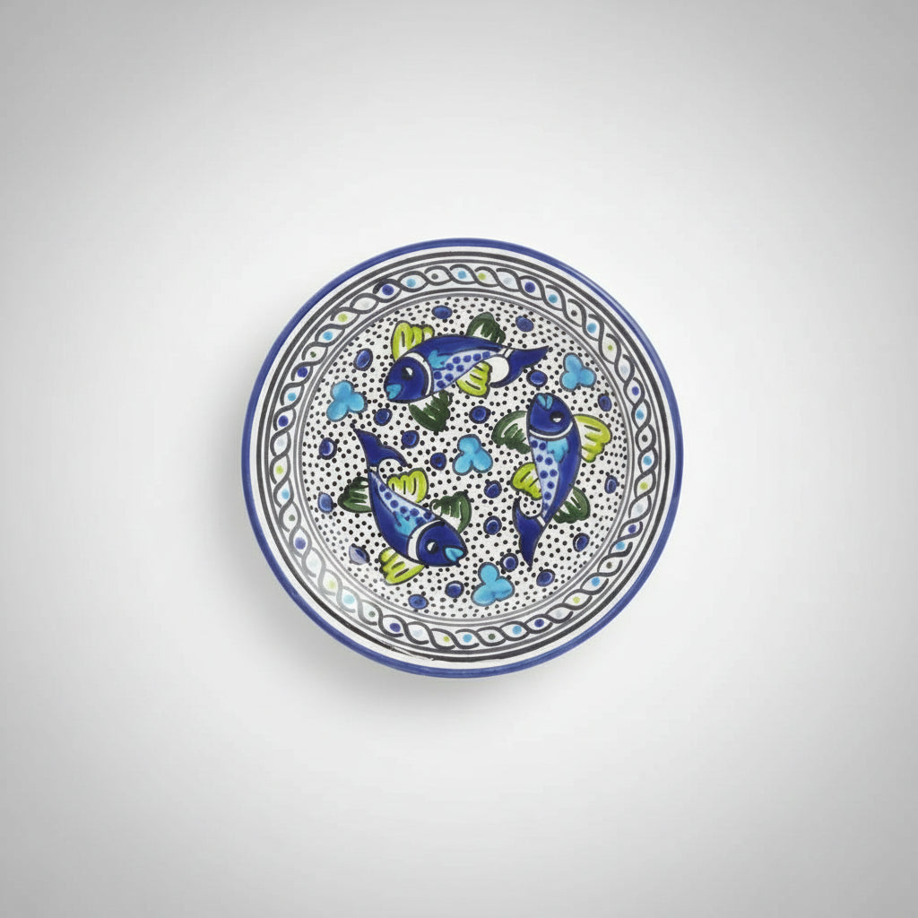 Handmade dinner plate with colorful fish design in food-safe paint