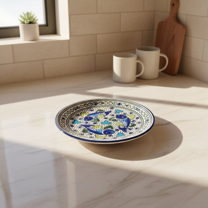 Handmade dinner plate with blue green fish design in food-safe paint