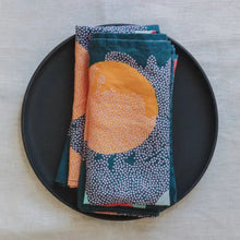 Handmade eco-friendly teal linen dinner napkins with sun and speckled pattern