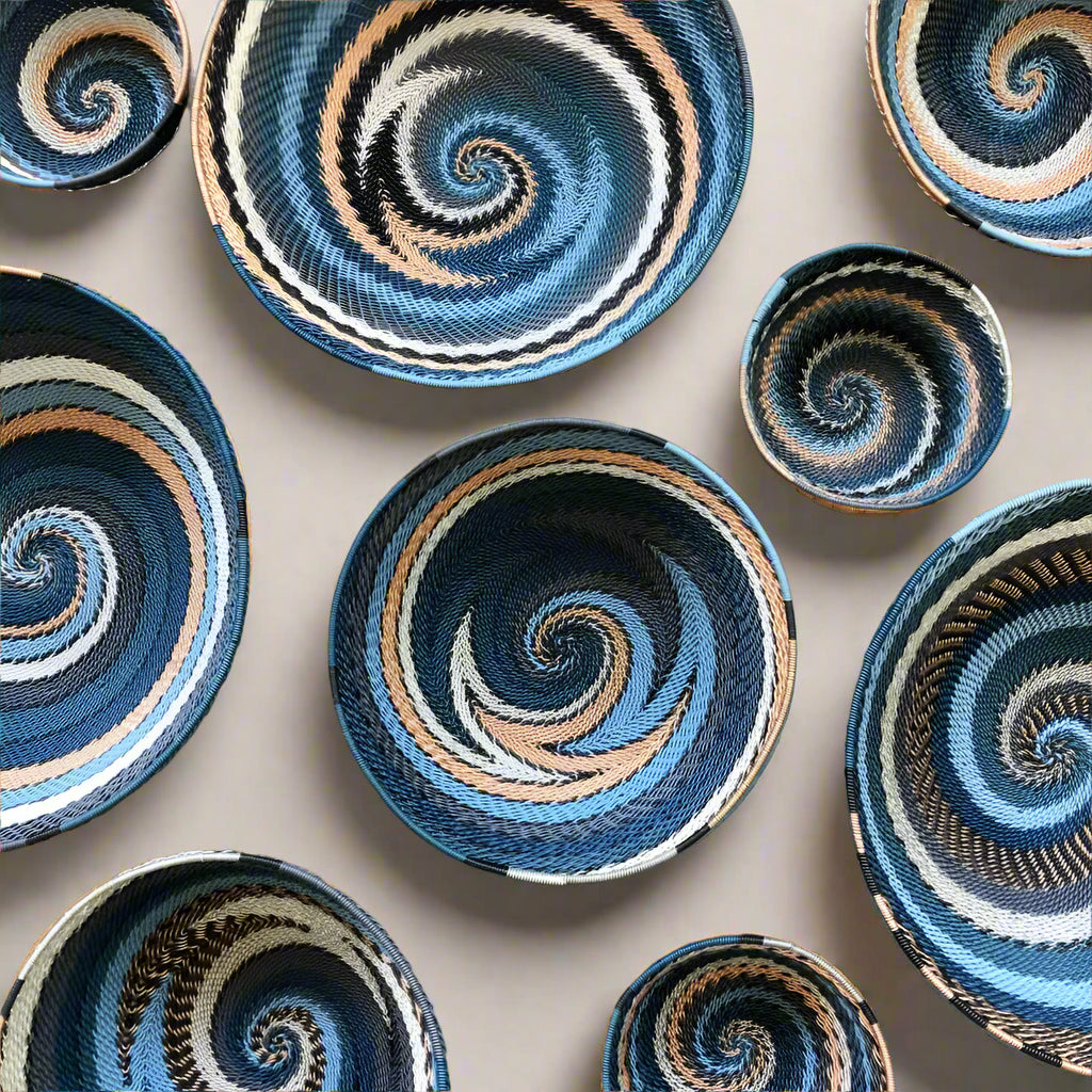Colorful South Africa city lights woven baskets with spiral patterns in blue black tan